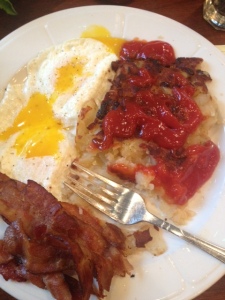 Fav diner meal. 2 eggs over medium, bacon, homefries doused in ketchup and hot sauce :-)